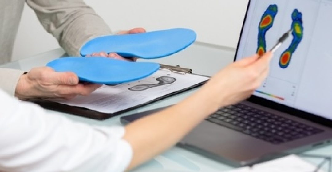 Doctor,Consulting,Male,Patient,On,Custom,Orthotic,Insoles,In,A
